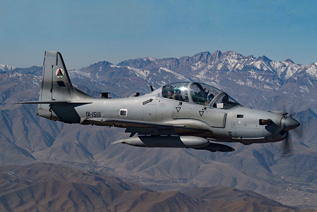 An Afghan pilot conducts training in an A-29 Super Tucano over Kabul, Afghanistan as part of the Train Advise and Assist Command's (TAAC-Air) mission on Dec. 20, 2018. The mission of TAAC-Air is to train, advise and assist Afghan partners to develop a professional, capable and sustainable Afghan Air Force. (U.S. Air Force photo/Senior Airman Maygan Straight)